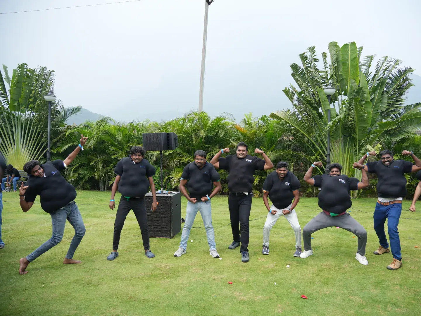 Team dancing on the lawn during offsite games