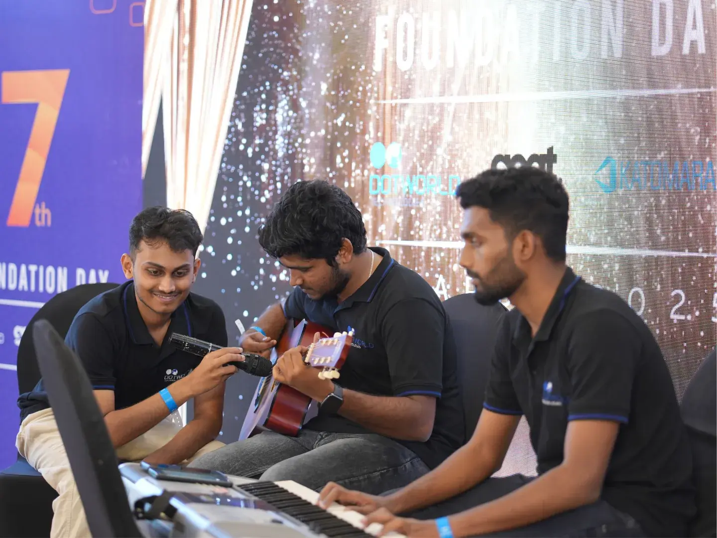 Team members performing music at Foundation Day