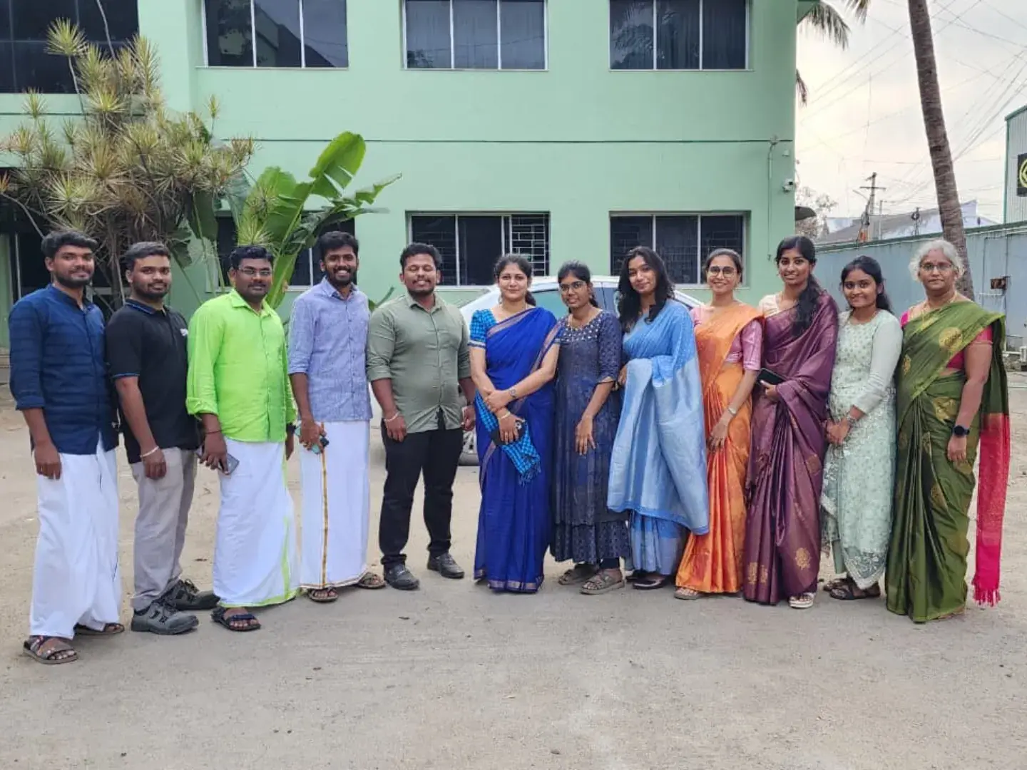 Team in traditional attire outside the Coimbatore office