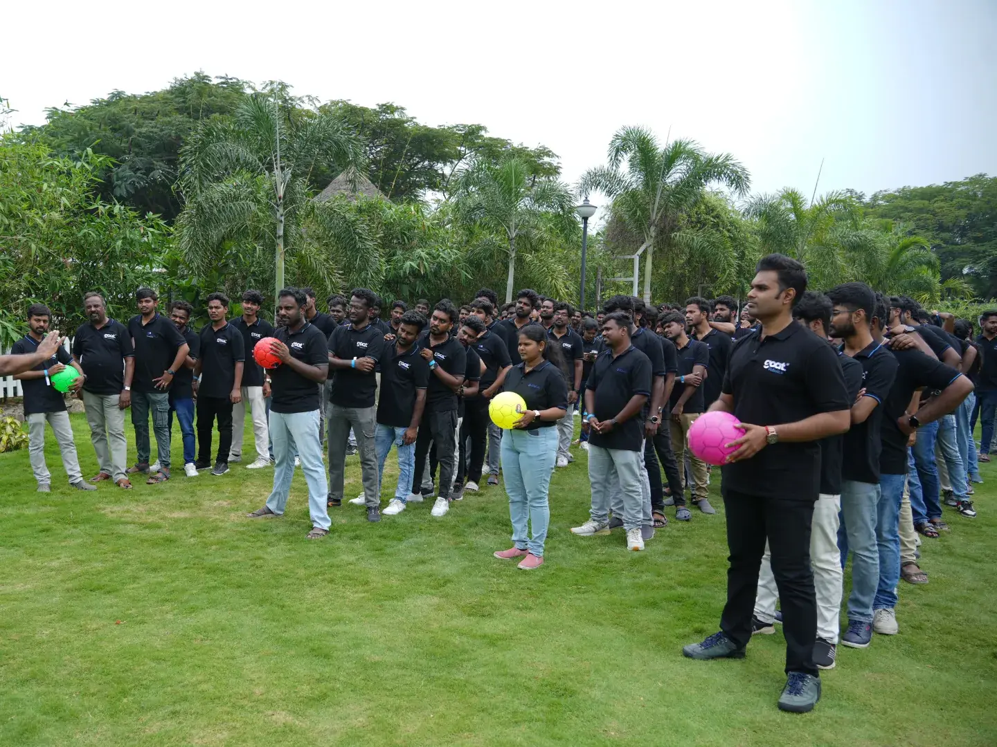 The whole team lined up for a balloon game