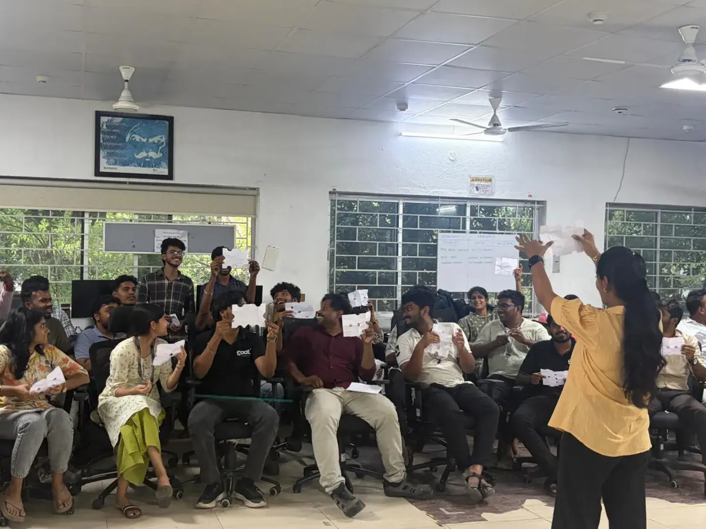 Team members at an all-hands session in the office