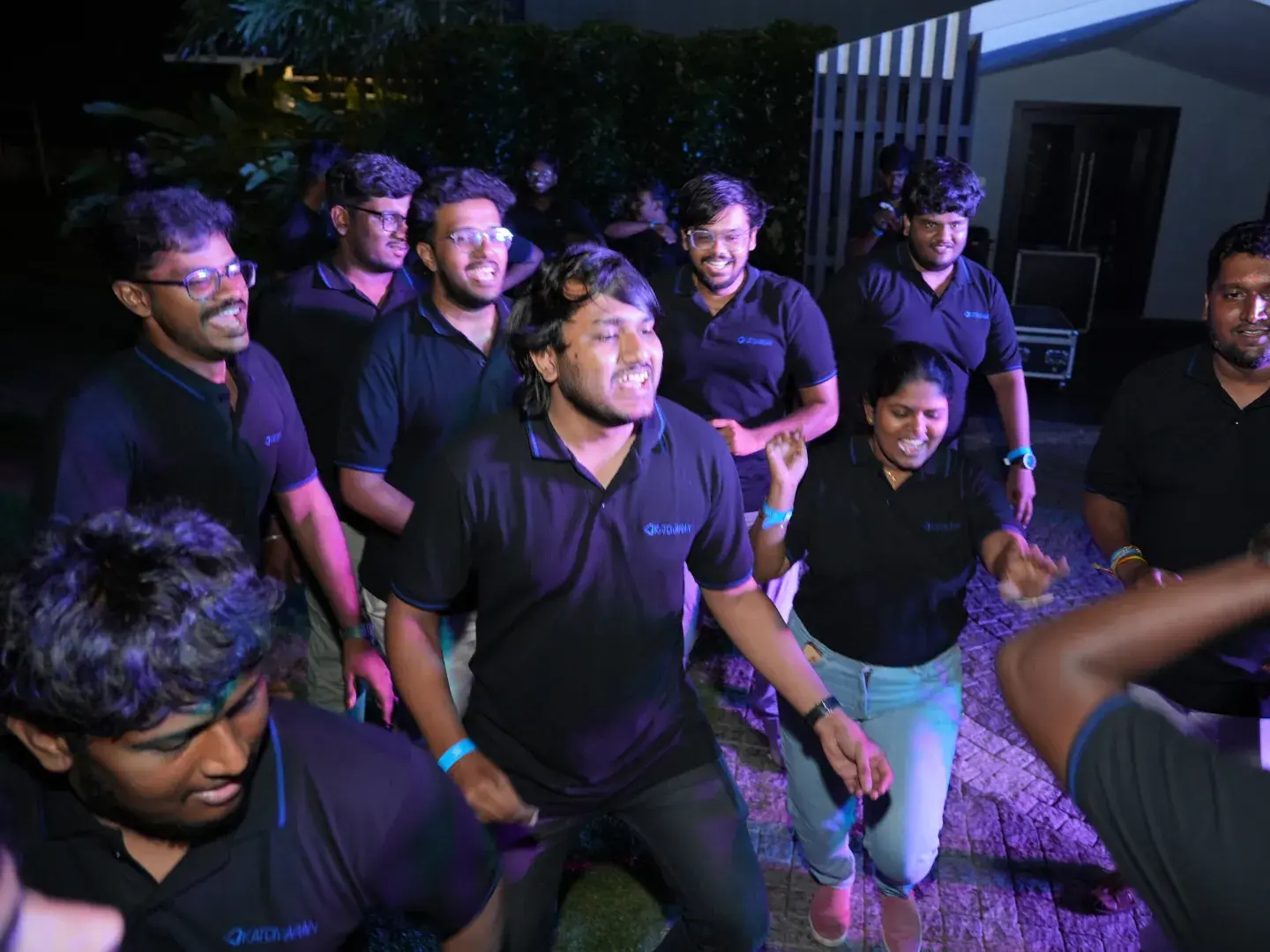 Team celebrating together at night