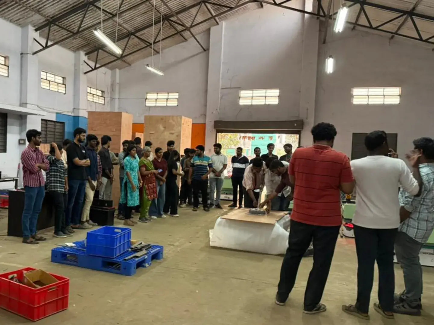 Team gathering inside the GOAT Robotics factory