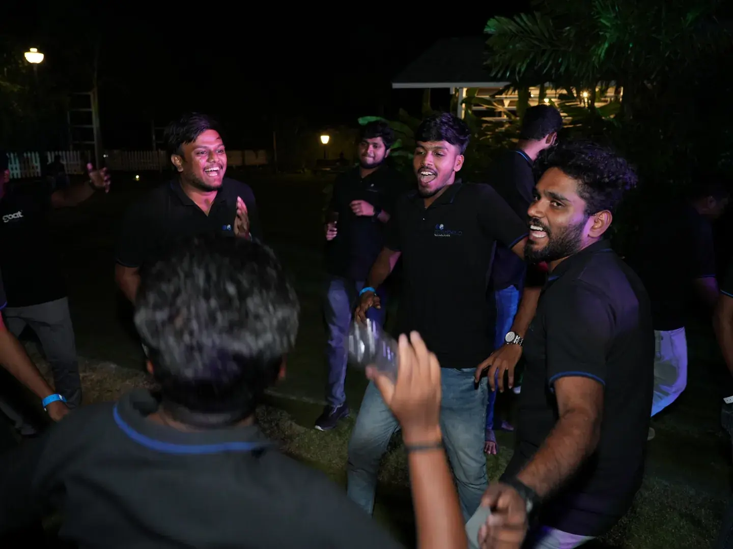Team members dancing at the evening party