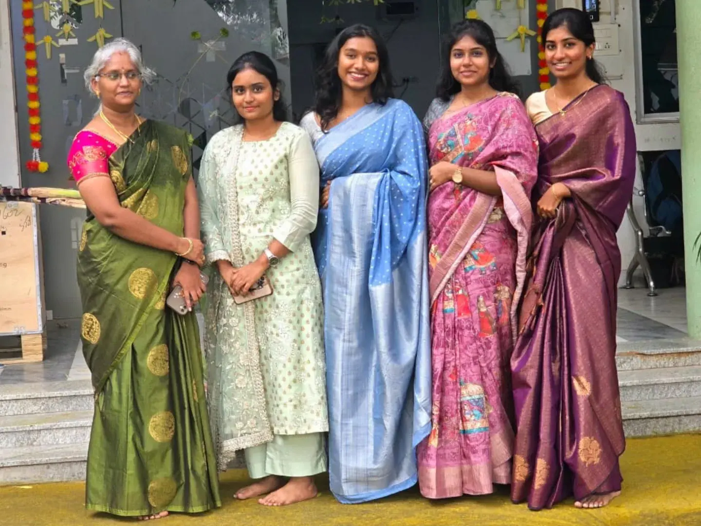 Colleagues in traditional sarees at the office