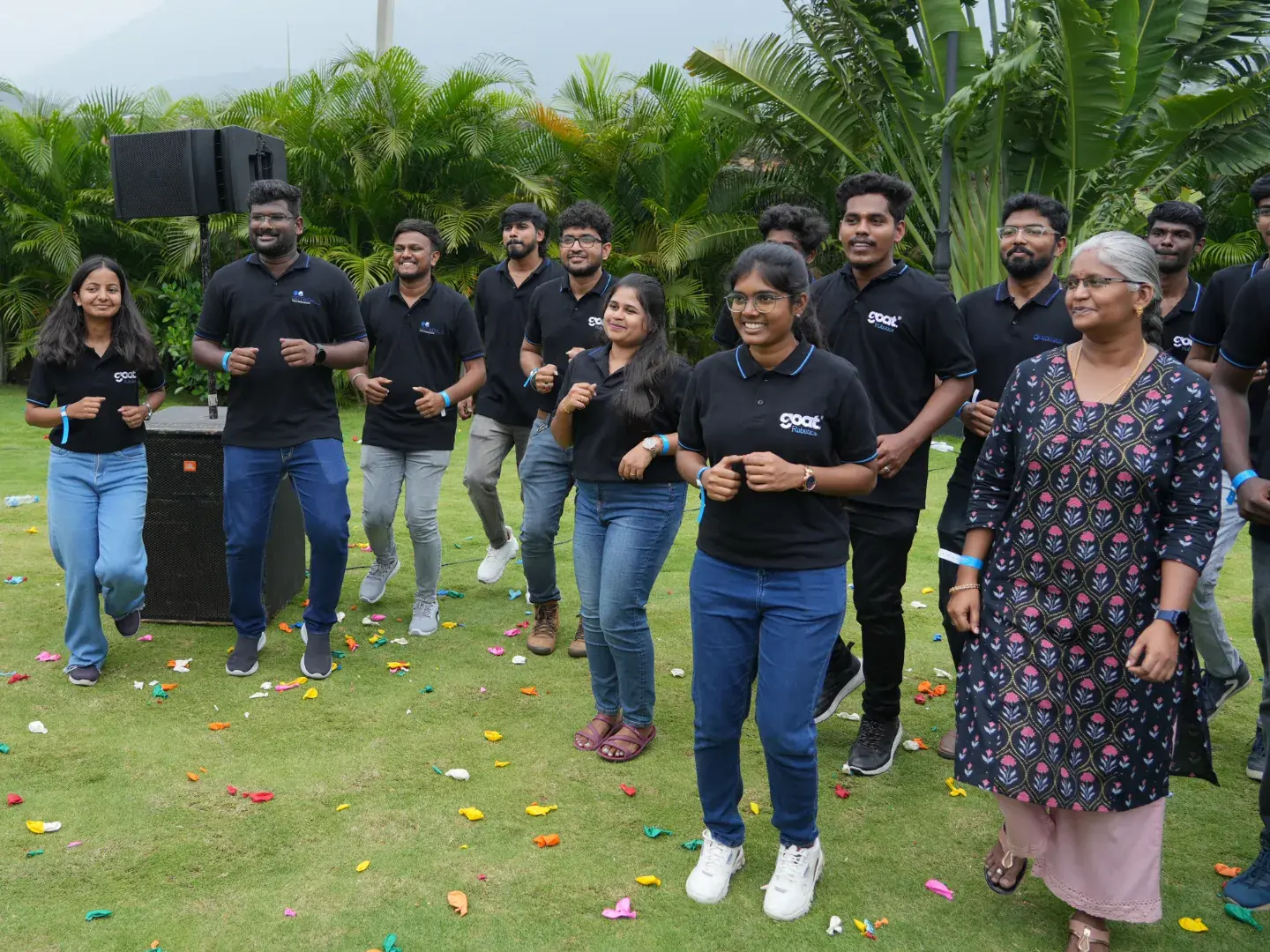 Team members racing in a balloon game