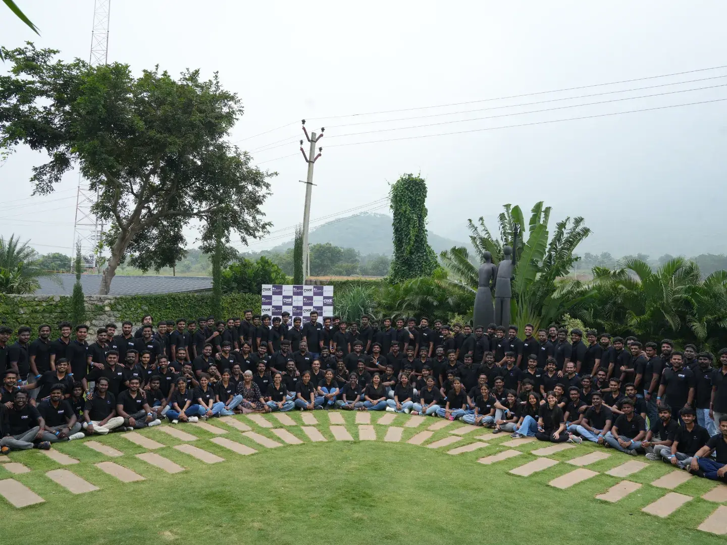 The full GOAT Robotics team in a circle on the lawn
