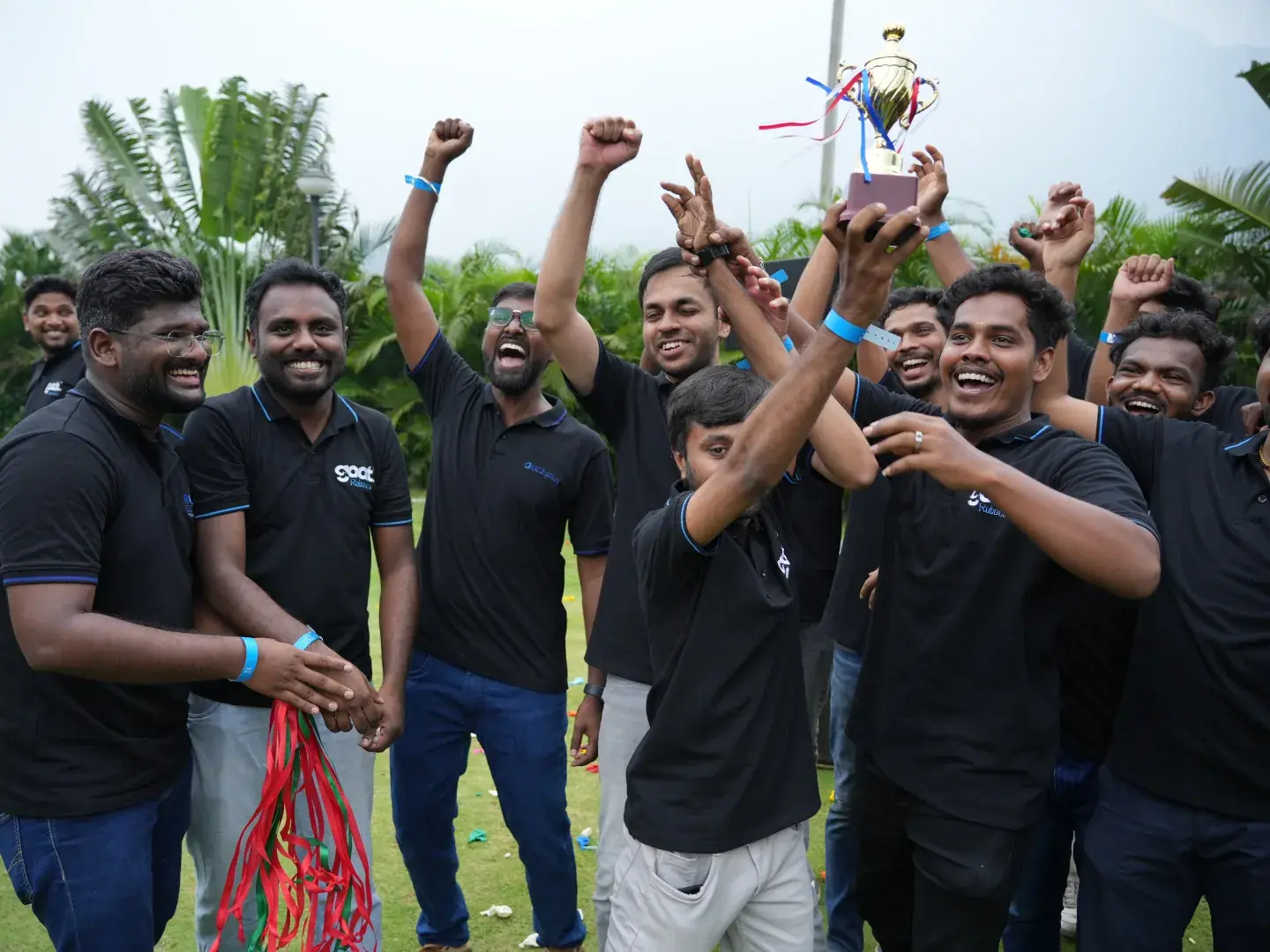 Team cheering with a trophy