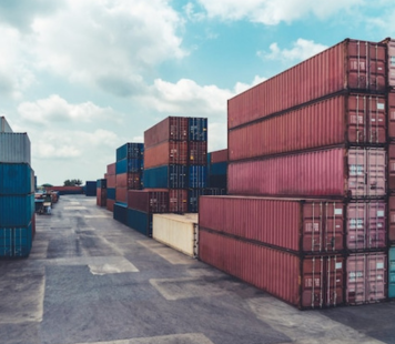 A yard full of stacked containers displays the scope and structure of the logistics sector.